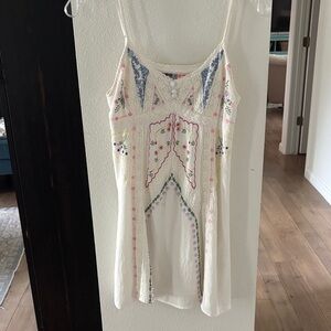 Urban Outfitters Cream Embroidered Floral sundresswith Pink & purple Accents